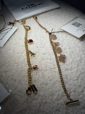 Coach Gold-Tone Multi Charm Necklace with Black and Pearl Accents